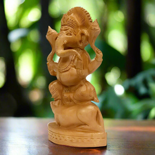 A handmade wooden Ganesha statue, perfect for home decoration and worship.