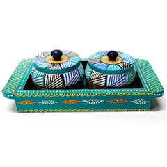 A handmade wooden tray with two containers for serving dry fruits.