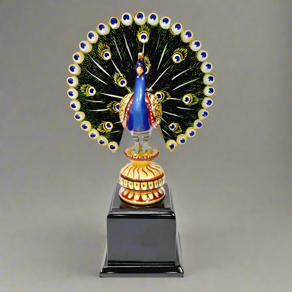 Hand-painted wooden peacock spreading its wings, crafted from dried wood, ideal as a decorative bird showpiece and gift.
