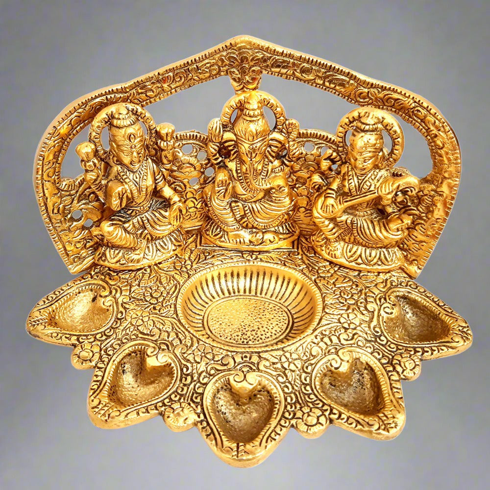 A golden Lakshmi and Ganesha statue, a perfect housewarming and wedding gift.