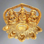 A golden Lakshmi and Ganesha statue, a perfect housewarming and wedding gift.