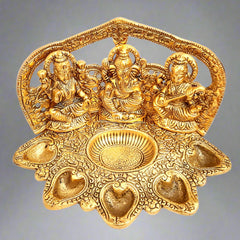A golden Lakshmi and Ganesha statue, a perfect housewarming and wedding gift.