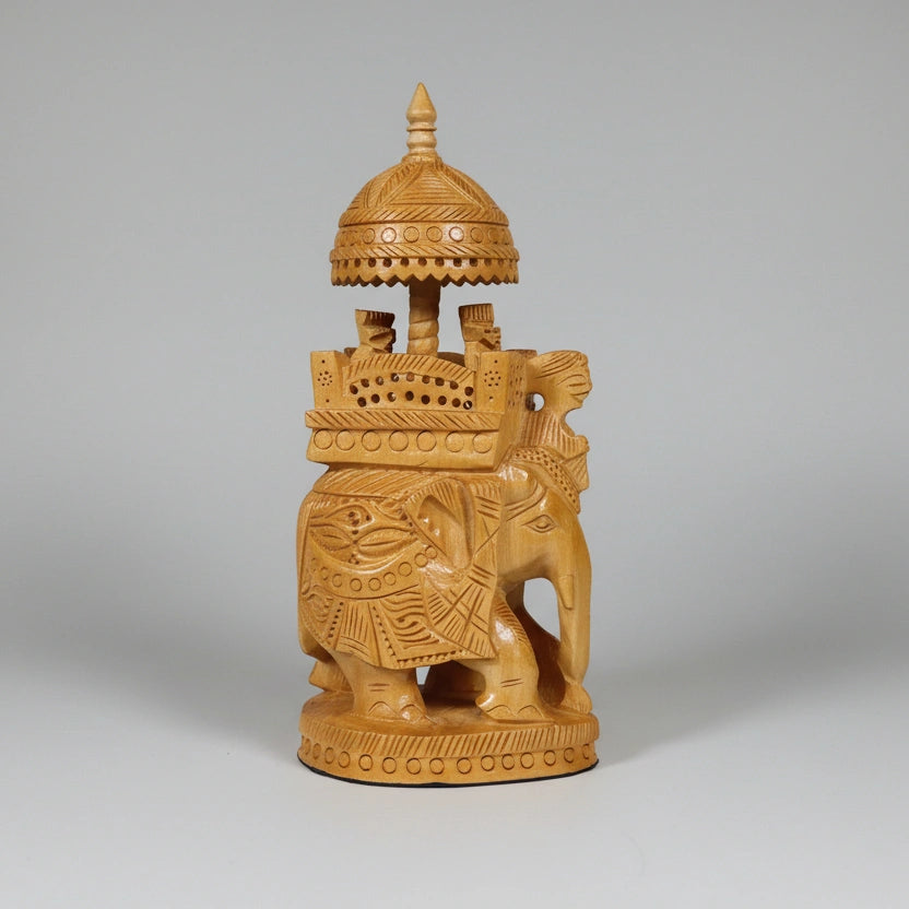 Hand-carved wooden elephant reflecting India royal heritage and Maharaja era grandeur.