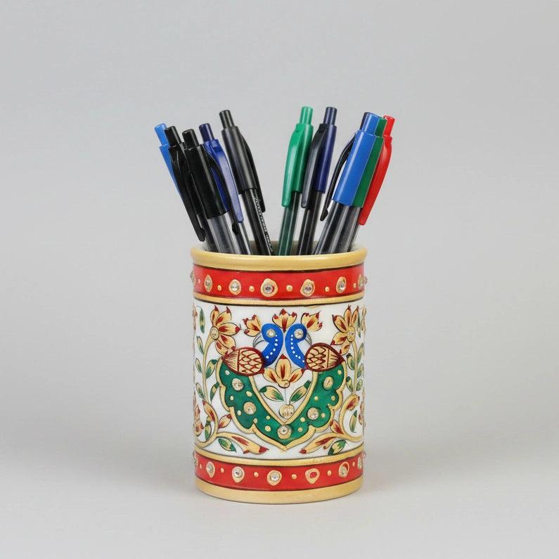 Close-up of a high-quality marble stationery holder showing detailed multi-colored emboss paint work and smooth white marble finish.