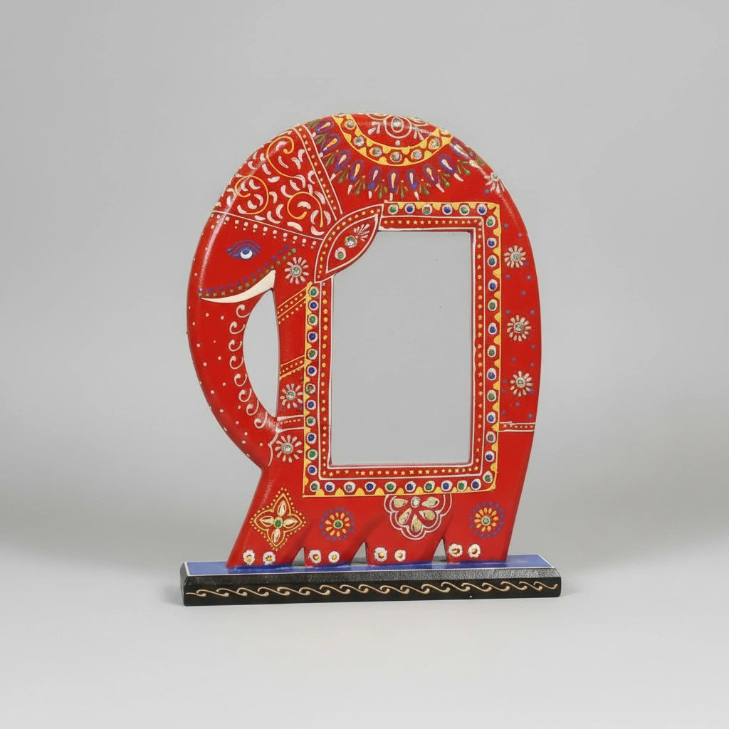 Traditional Indian folk art style picture frame in the shape of a red elephant, decorated with vibrant hand-painted floral motifs and textured emboss patterns.