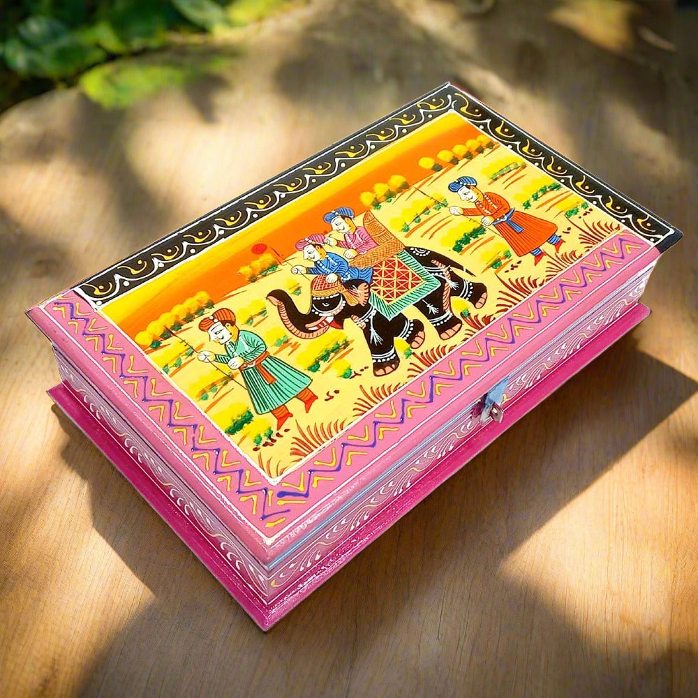 An Indian miniature painting on a wooden gift box, a thoughtful present for a special occasion.
