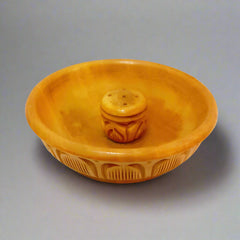 An Indian-style wooden incense holder with a traditional carving, perfect for a gift.
