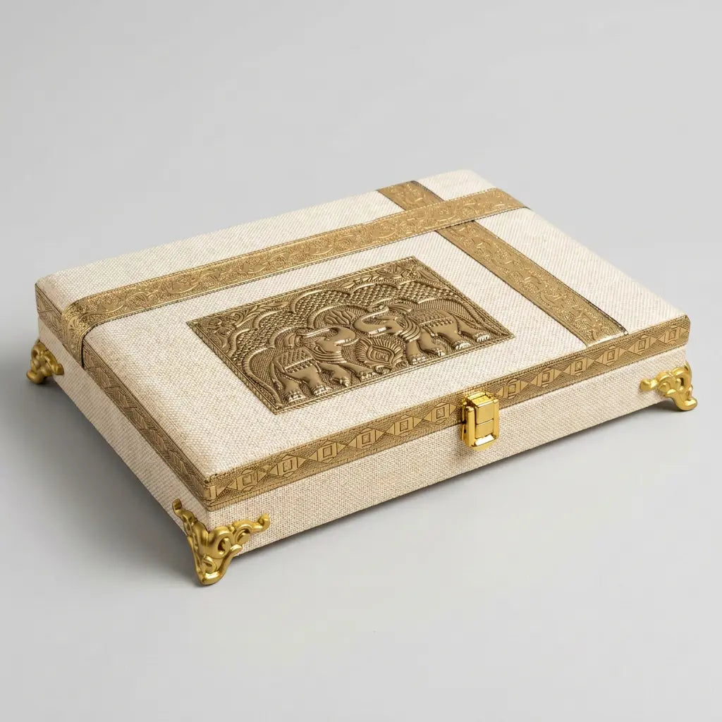 Ivory jute-covered wooden gift box with a gold-tone elephant design