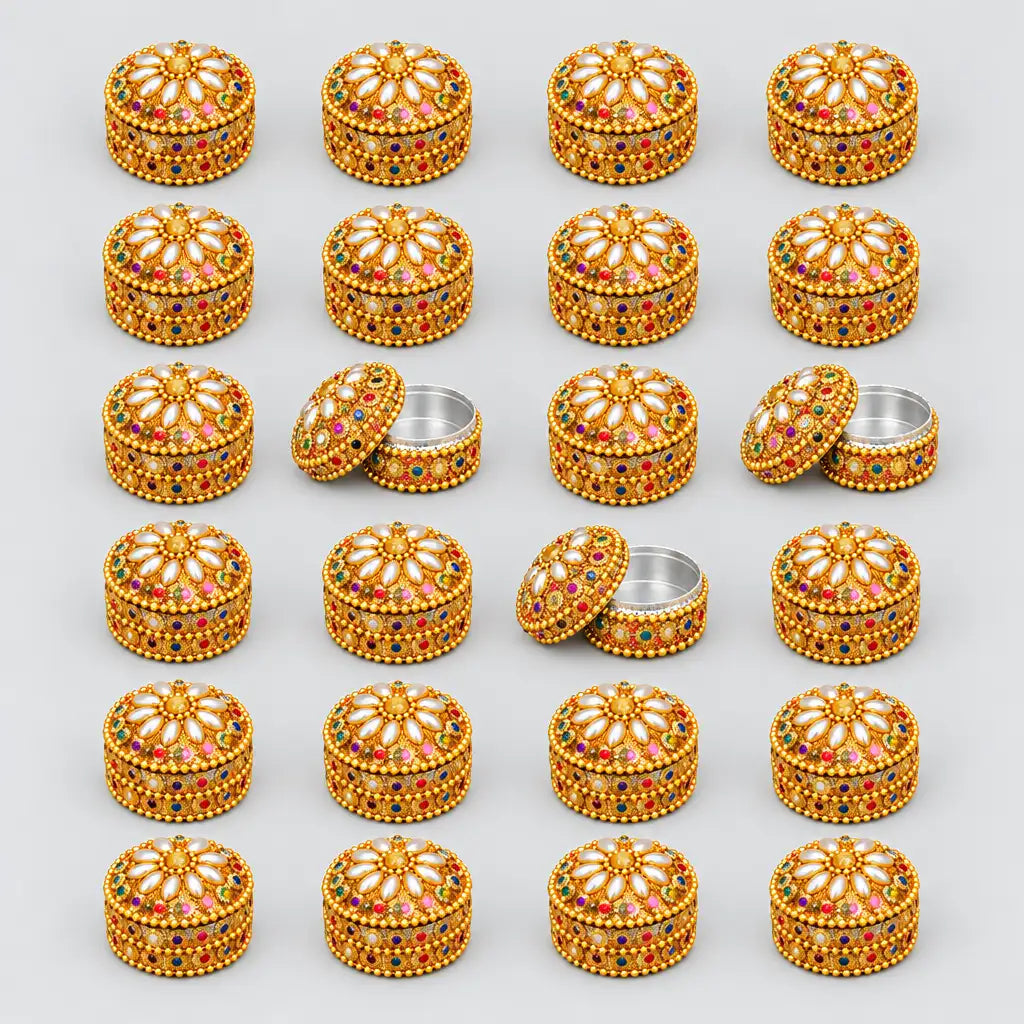 24 gold-toned Jaipuri lac kumkum boxes arranged in rows, with some lids open to show the interiors