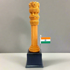 An Ashoka Pillar made from Kadamba wood, featuring intricate carvings on its tall cylindrical shape.
