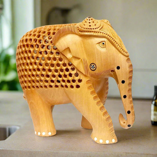 A Kadamba wood elephant with an intricate lattice design and smooth finishing.