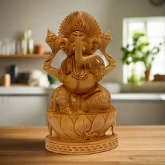 A beautiful Ganesh idol made of Kadamba wood, seated on a wooden lotus.