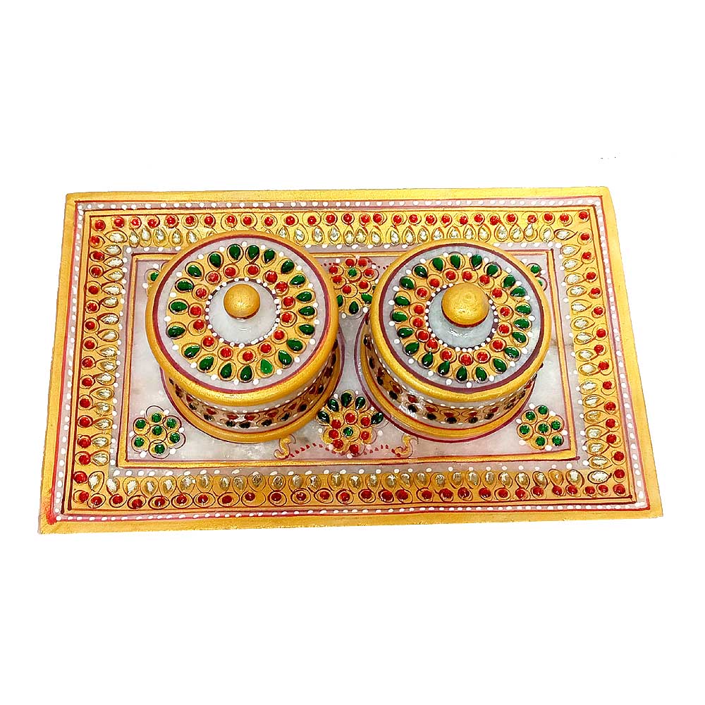 A marble container set with a matching tray, perfect for kitchen and dining use.