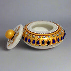 Marble kumkum box decorated with kundan stones and hand painted, perfect for storing pooja sindoor.