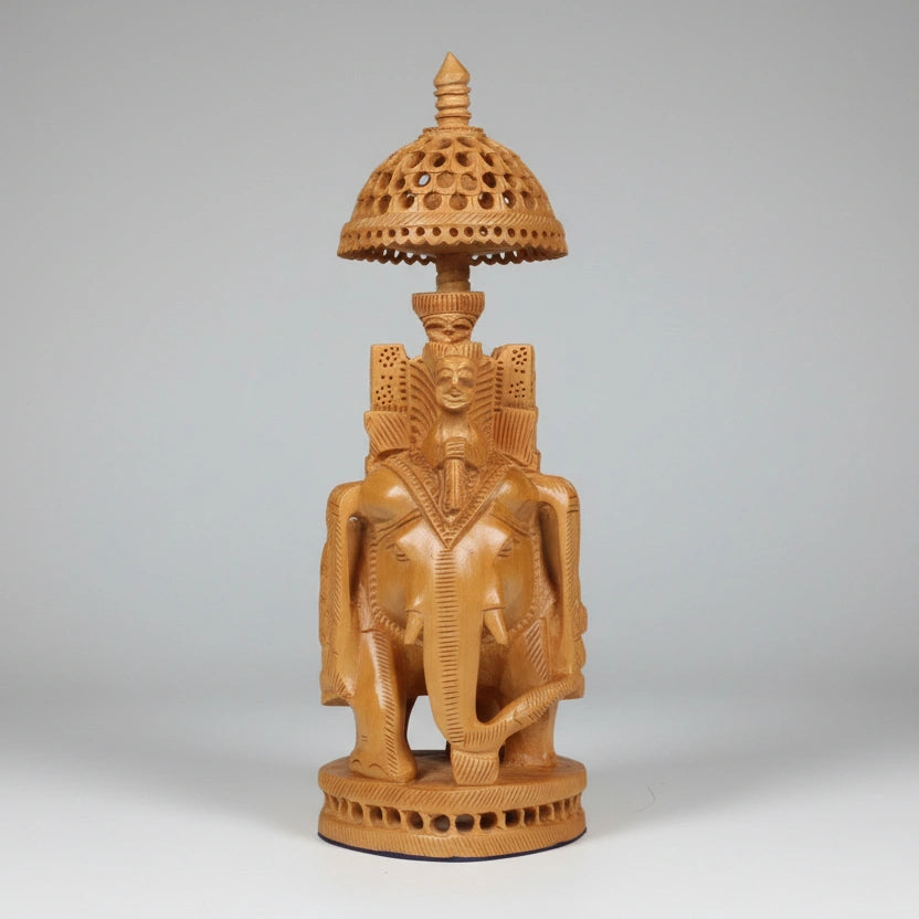 23cm Kadamba wood Ambari elephant featuring intricate hand-carved lattice undercut patterns.