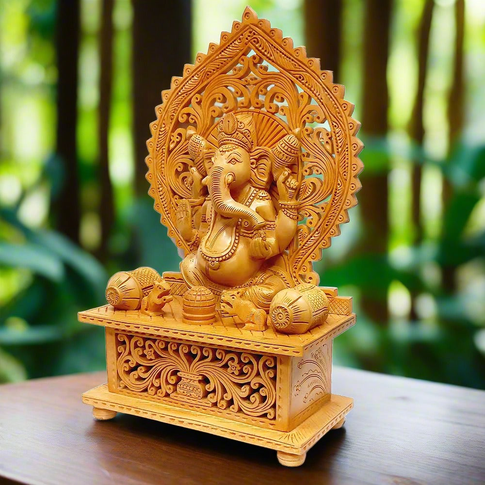 Wooden Lord Ganesha statue holding laddu in one hand and blessing with the other.