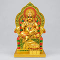 Seated Lord Kuber statue on an ornate throne, front view, with golden, red and green detailing