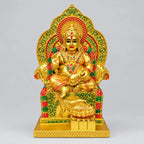Seated Lord Kuber statue on an ornate throne, front view, with golden, red and green detailing