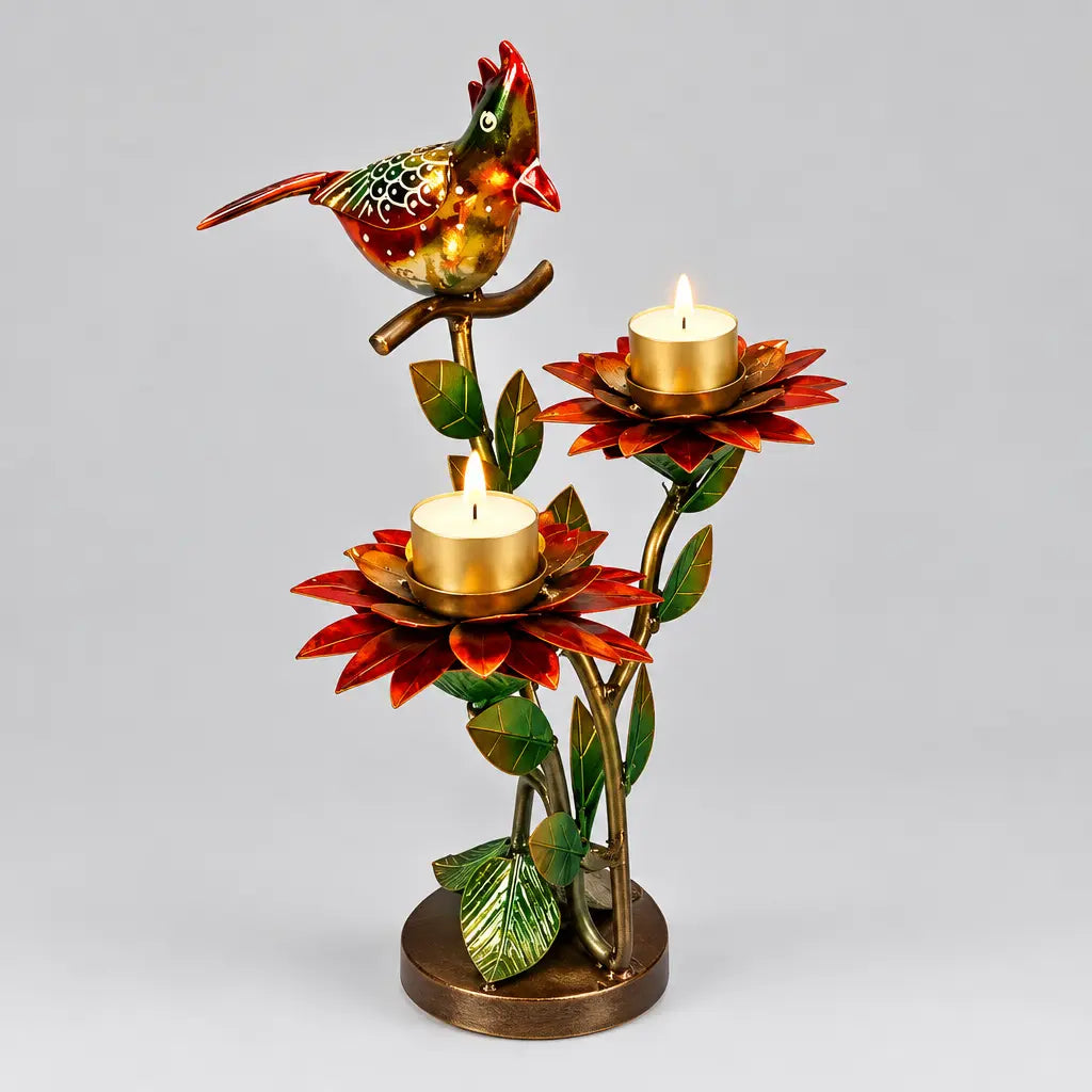Decorative candle holder with a colourful bird, two red lotus-shaped candle cups and green leaves on a round base