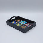 A 30cm handcrafted wooden tray with ceramic inlays placed as a decorative centerpiece on a modern coffee table.