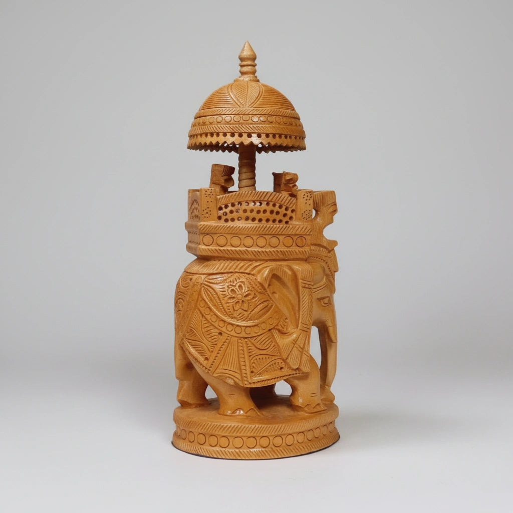 Detailed view of the royal howdah and decorative canopy on a wooden elephant statue.