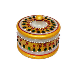 A decorative marble box for storing and serving dry fruits and nuts.