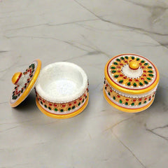 An elegant marble containers for organizing dry fruits.