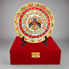 Round marble decorative plate featuring hand-painted embossed floral designs, presented in a luxurious velvet box with a wooden stand.