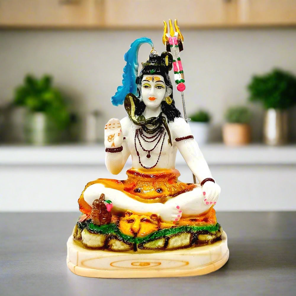 A marble dust Lord Shiva idol giving blessings, with beautiful hand painting.