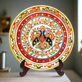 A hand-painted marble decorative plate with intricate details, including a wooden stand.
