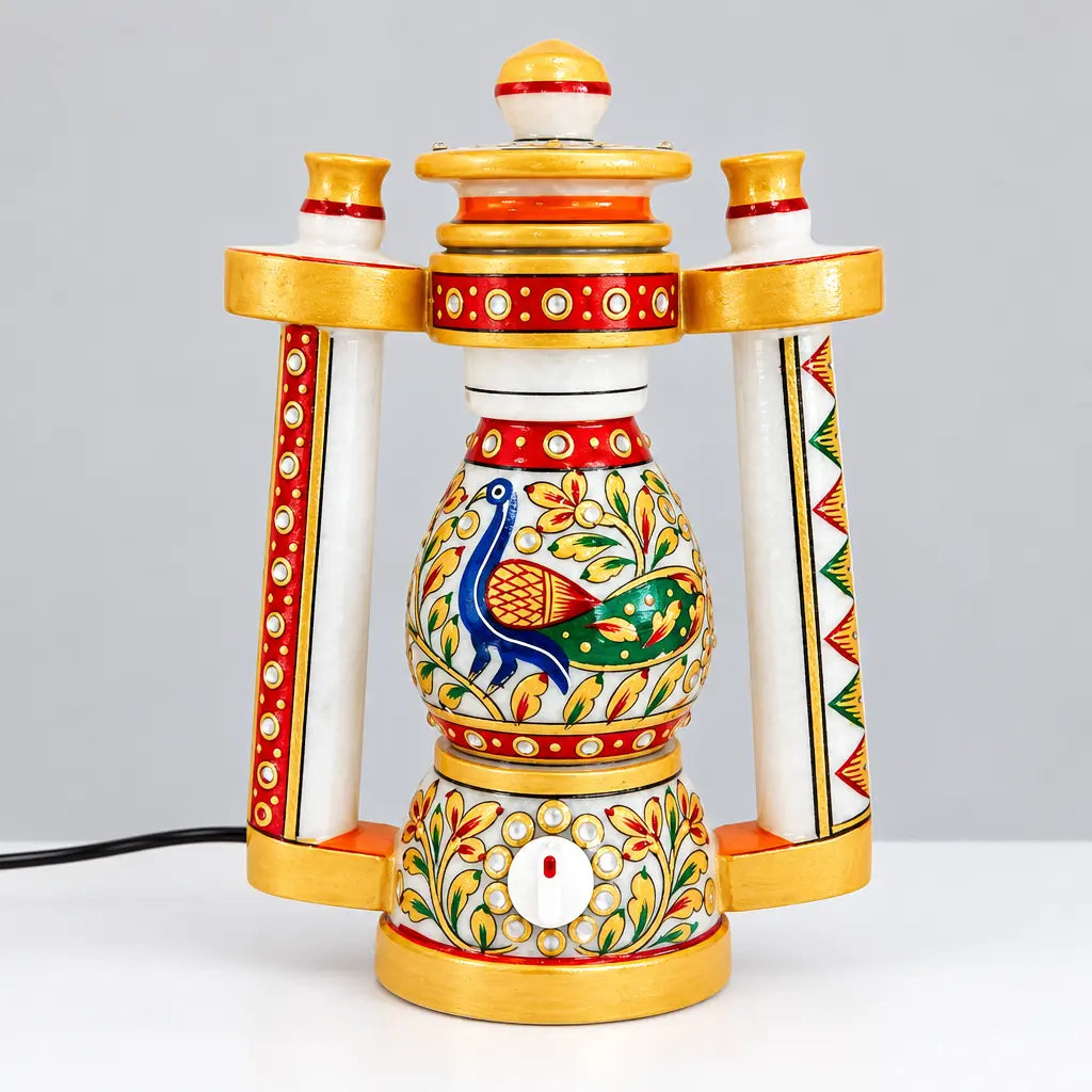 Front view of a marble lantern lamp with a blue and green peacock, floral artwork, red borders and gold trim
