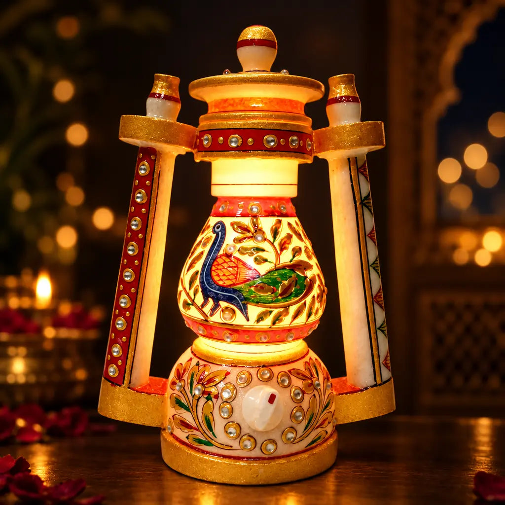 Illuminated marble lantern lamp casting a warm golden glow through peacock and floral artwork, with a regulator on the base