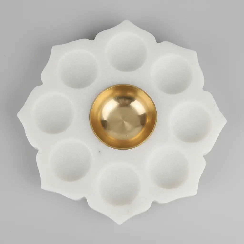 White Marble Lotus 9 Diya Plate with Brass Bowl in Festive Pooja Setup with Marigolds