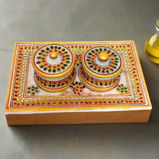 A marble tray with two matching containers, a versatile home decor item.