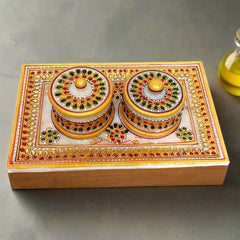 A marble tray with two matching containers, a versatile home decor item.