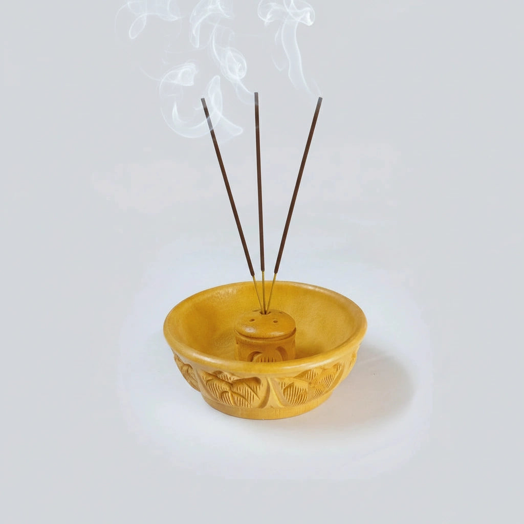 Traditional carved wood incense burner for meditation corners and yoga studios.