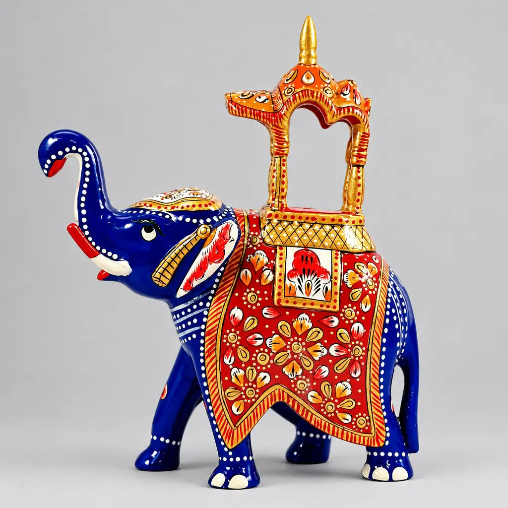 Left-side view of a blue Ambabari elephant statue showing white dotted detailing, a red floral saddle and a gold-trimmed canopy.