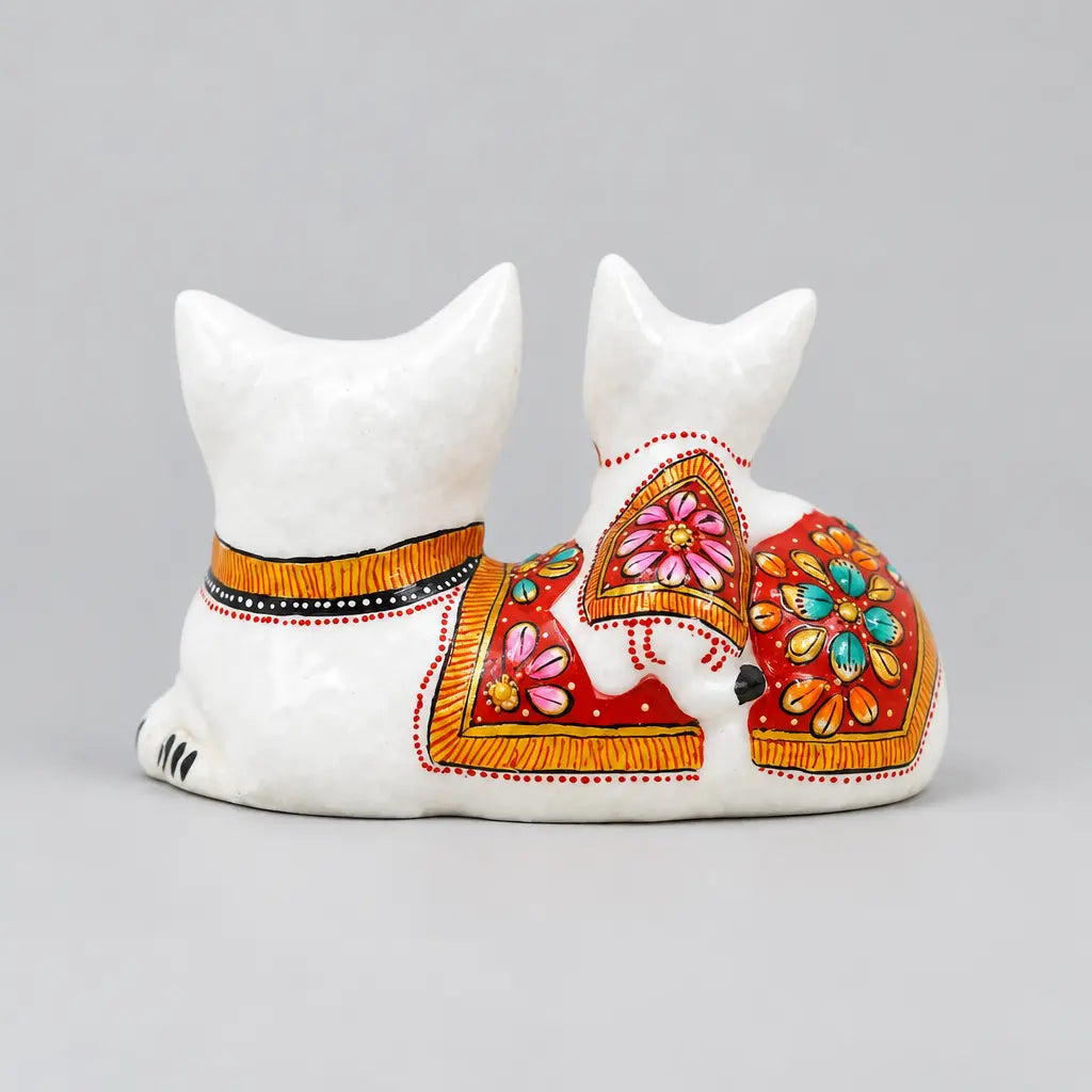 Back view of a white Meenakari cat and kitten showpiece with red floral panels and gold detailing