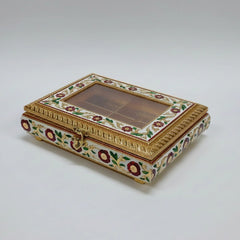 Royal Meenakari dry fruit box with a transparent acrylic glass lid and colorful floral enamel work on a metal sheet.