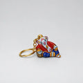 Metal Meenakari Ganesha keychain in a peaceful resting pose