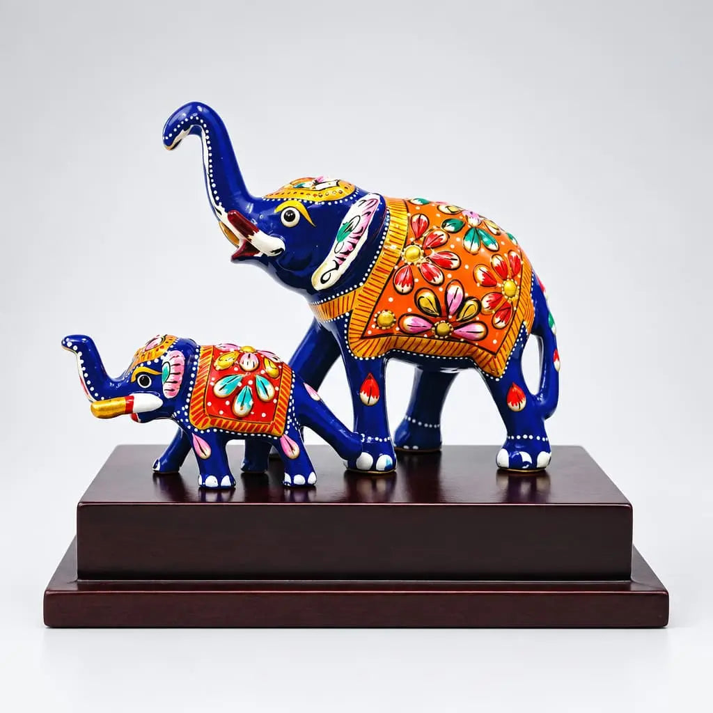 Meenakari mother and baby elephant figurine in metal on a wooden base
