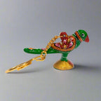 Traditional Indian Meenakari parrot key holder showcasing fine craftsmanship.