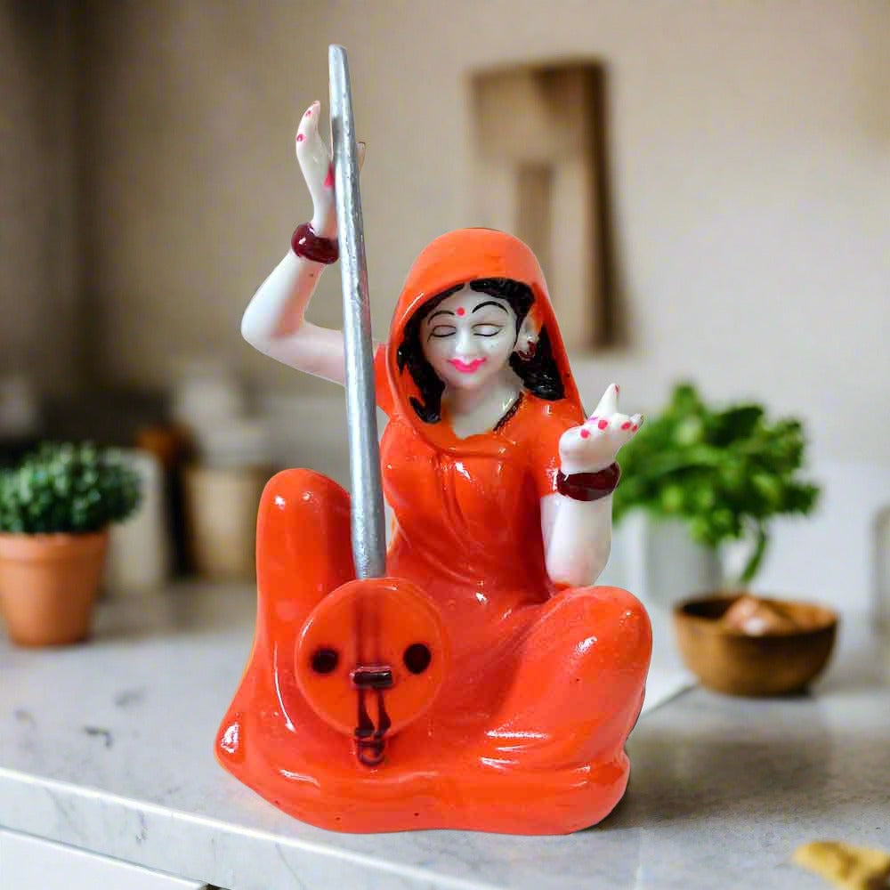 Hand-painted Meera Bai statue made of marble dust, showing her playing ektara in devotion