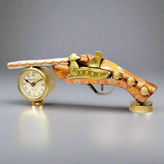 A metal showpiece with a gun motif and a clock, perfect for an office table.