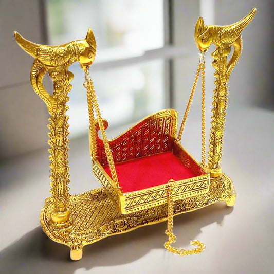 Metal Laddu Gopal Jhula swing with red velvet cradle for home temple.