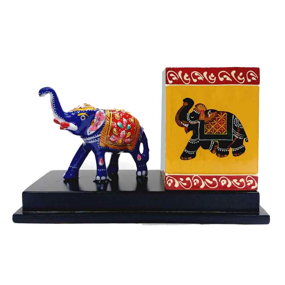 A metal Meenakari elephant pencil stand for a desk, adding a touch of Indian decor to an office.
