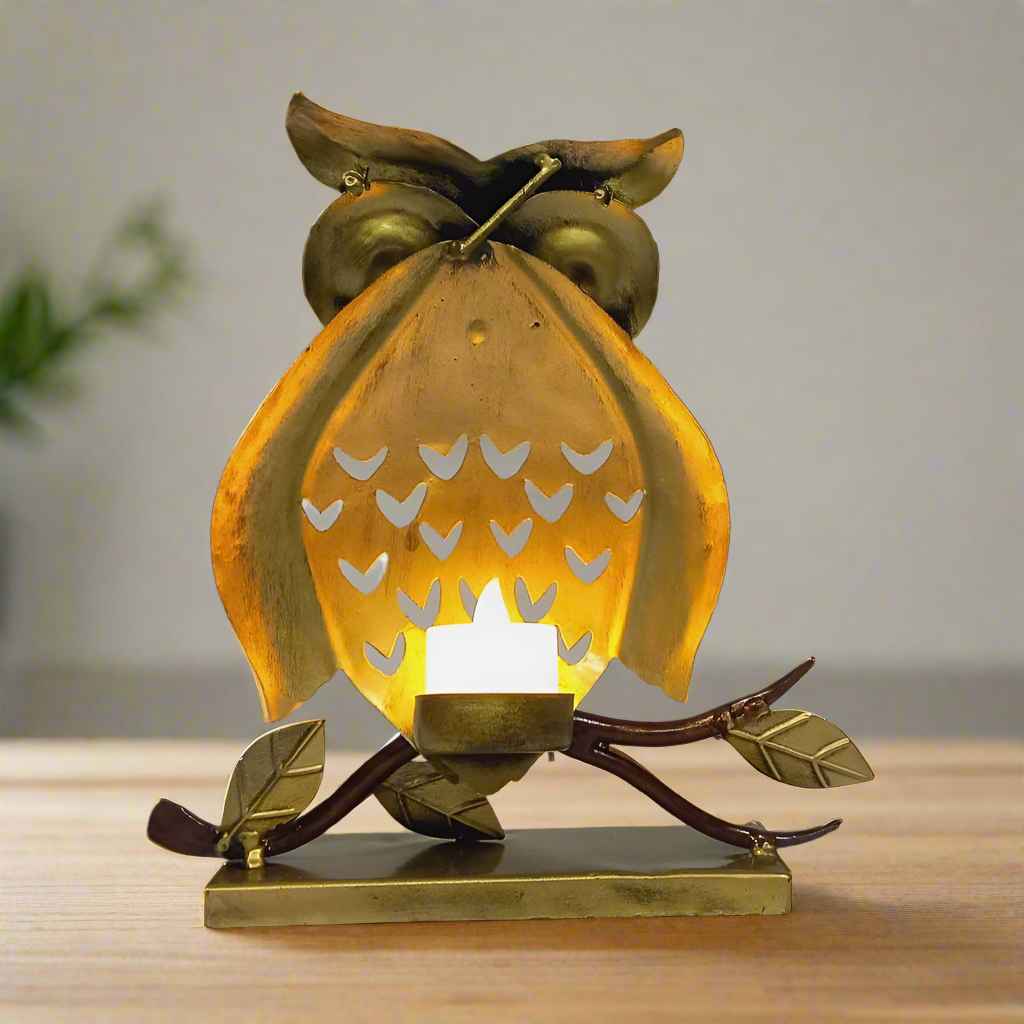 Metal owl candle holder with backlight feature and antique detailing.