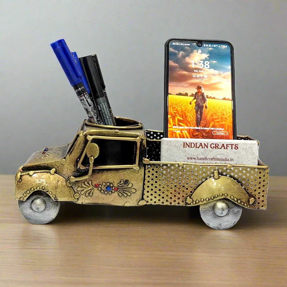 A metallic car desk organizer with a beautiful antique design, perfect for storing pens and cards.