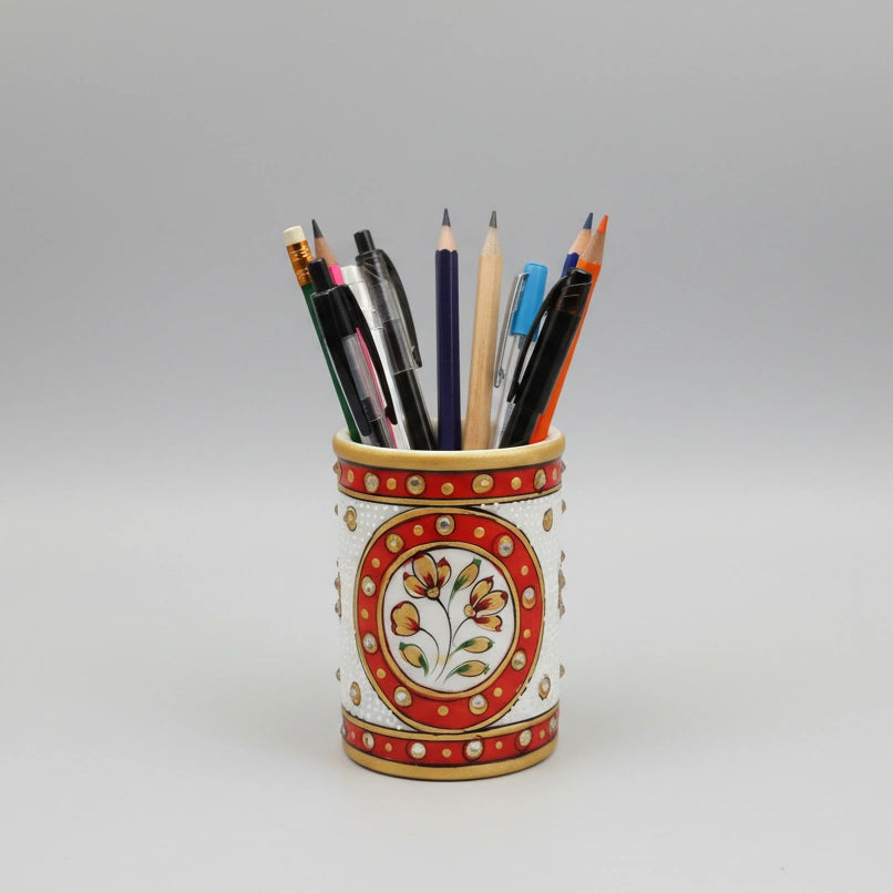 A sleek white marble pencil holder with vibrant floral hand-painting, blending traditional art with modern home office decor.