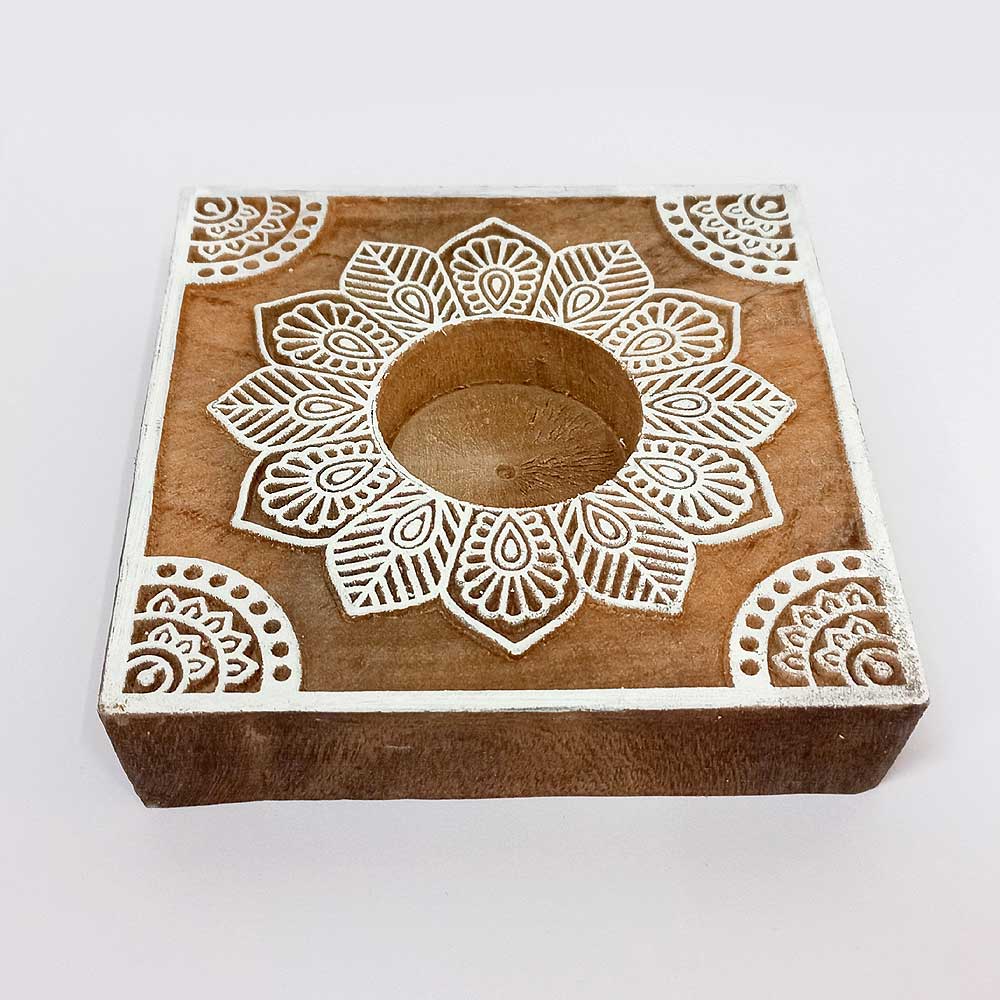 A minimalist wooden taper candle holder, great for a modern or Scandinavian decor style.